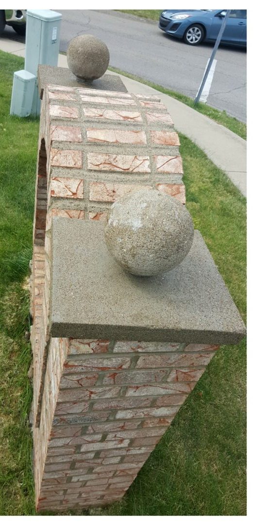 Stone entrance pillar after restoration cleaning
